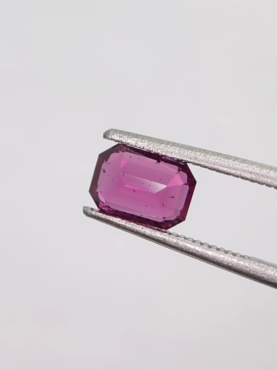 1.8ct Natural Emerald Cut Faceted Malaya Garnet from Tanzania — view 1
